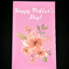 Pink Happy Mother's Day card with flowers.