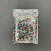 A bag of colorful iridescent glitter.