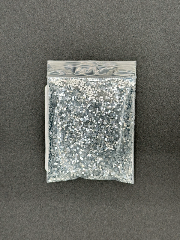 Silver glitter in a plastic bag.