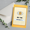 Yellow card with smiling sun, "Open me up" text.