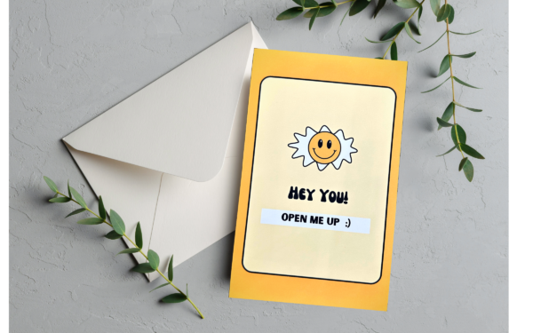 Yellow card with smiling sun, "Open me up" text.